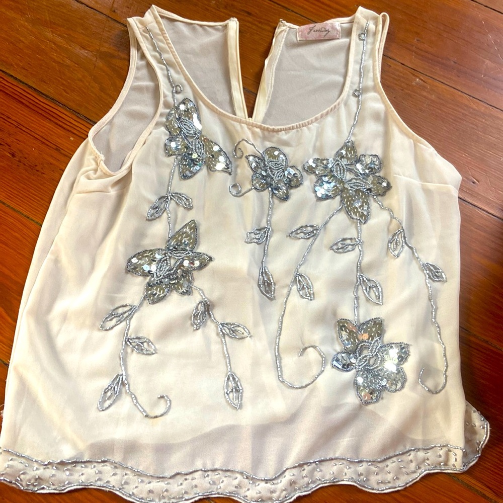 Beaded dress too with small discoloration on back